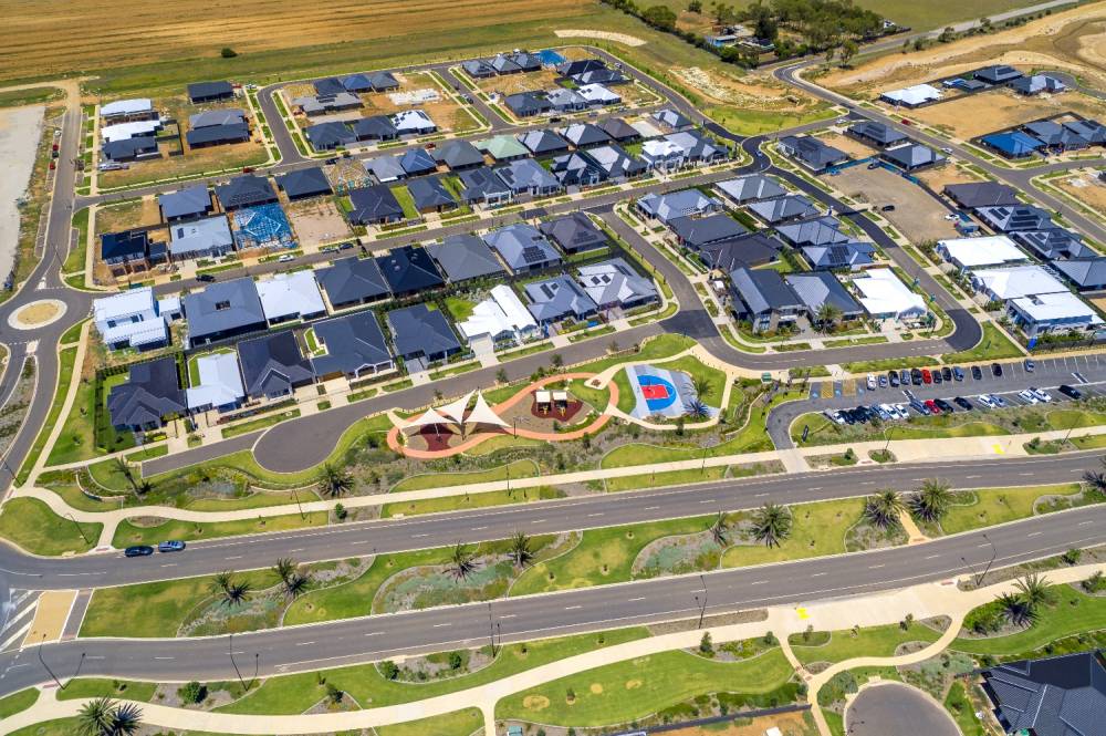 Aerial of an Adelaide growth-corridor estate with new homes and finished land